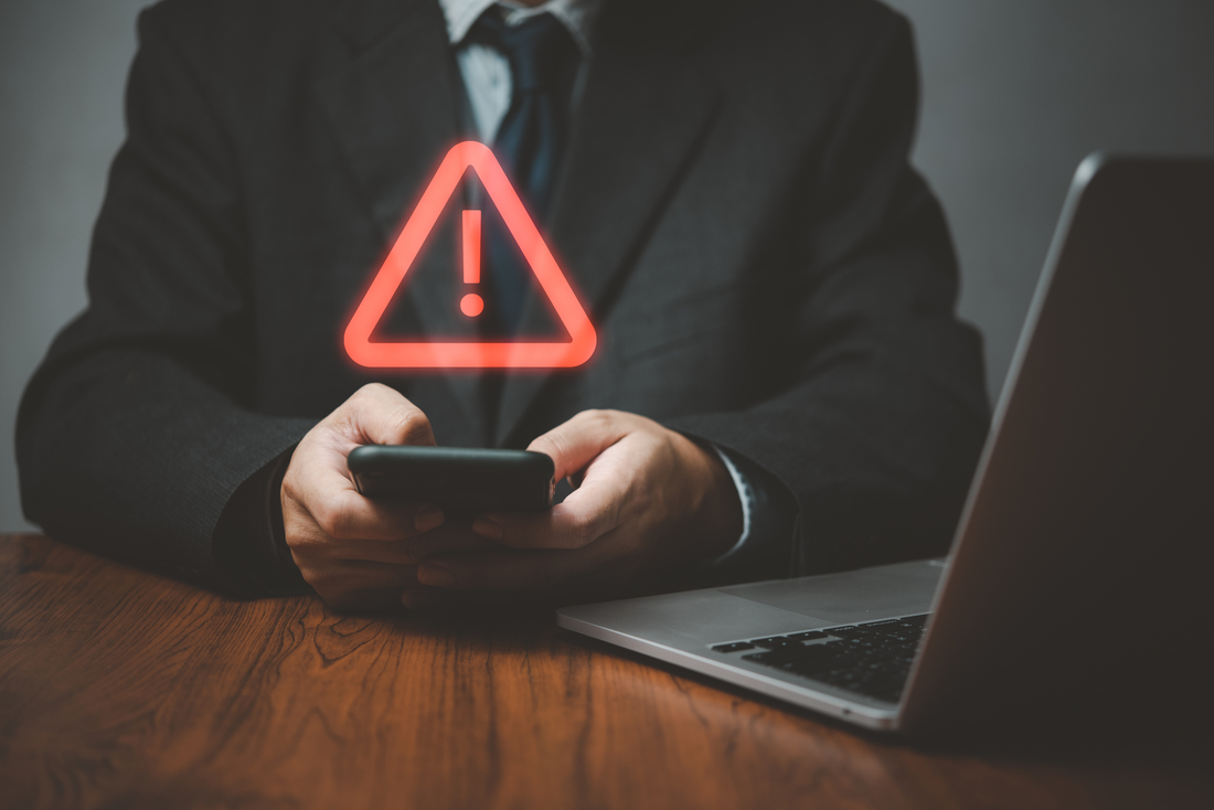 Businessman Receiving Mobile Alert